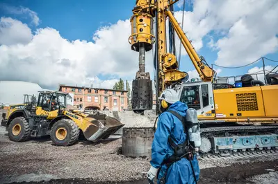 The team from Bauer Resources is equipped with special protective suits during drilling of large-scale boreholes on the site of Magdeburg fitting production facility